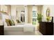 Cozy bedroom featuring stylish decor, ample natural light, and a view of the outdoors at 4006 Northern Key Dr, Plant City, FL 33563