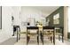 Open-concept dining area seamlessly connects to a modern kitchen with stainless steel appliances at 4006 Northern Key Dr, Plant City, FL 33563
