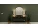 Elegant entryway featuring a decorative mirror, stylish console table, and lush greenery at 4006 Northern Key Dr, Plant City, FL 33563
