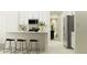 Bright, modern kitchen with stainless steel appliances, white cabinetry, and breakfast bar seating at 4006 Northern Key Dr, Plant City, FL 33563