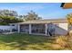 The back yard features a covered patio and grassy area at 4106 W Bay View Ave, Tampa, FL 33611