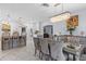 Elegant dining room featuring a modern chandelier, marble floors, and neutral color palette at 4106 W Bay View Ave, Tampa, FL 33611