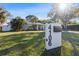 Well-manicured front yard with lush green grass and mature landscaping at 4106 W Bay View Ave, Tampa, FL 33611
