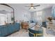 Chic living room with stylish furniture, a large mirror, and plenty of natural light at 4106 W Bay View Ave, Tampa, FL 33611