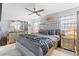 Luxurious bedroom with a tufted headboard, mirrored accents, and elegant decor at 4106 W Bay View Ave, Tampa, FL 33611