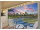 Relaxing balcony view overlooking lush golf course and a pond, framed by a beautiful sunset at 5900 Bahia Del Mar Cir # 237, St Petersburg, FL 33715