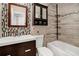 Modern bathroom showcases tiled shower, vanity with sink, and black accents at 6023 Ambassador Dr, Tampa, FL 33615