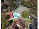 Aerial view showcases the community pool, tennis courts, and well-maintained landscaping at 6262 142Nd Ave # 506, Clearwater, FL 33760