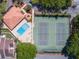 Aerial view of a community pool and tennis courts at 6262 142Nd Ave # 506, Clearwater, FL 33760