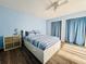 Light and airy bedroom with wood floors, two closets, and a ceiling fan at 6262 142Nd Ave # 506, Clearwater, FL 33760