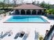 Community pool with poolside seating and manicured landscaping at 6262 142Nd Ave # 506, Clearwater, FL 33760