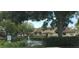 Scenic view of the pond and surrounding community buildings with fountain at 6262 142Nd Ave # 506, Clearwater, FL 33760