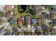 Stunning aerial view of a neighborhood featuring a pond, manicured lawns, and well-maintained homes at 7634 Nottinghill Sky Dr, Apollo Beach, FL 33572