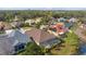 Aerial view of neighborhood showing trees and well maintained lawns at 7634 Nottinghill Sky Dr, Apollo Beach, FL 33572