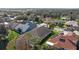 Aerial view of neighborhood showing trees and well maintained lawns at 7634 Nottinghill Sky Dr, Apollo Beach, FL 33572