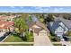 Aerial view of the home and property showing the lawn and landscaping at 7634 Nottinghill Sky Dr, Apollo Beach, FL 33572