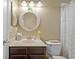 Bathroom featuring a decorative mirror, a neutral color scheme, and updated fixtures at 7634 Nottinghill Sky Dr, Apollo Beach, FL 33572