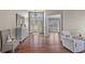 Spacious foyer with hardwood floors and elegant chandelier at 7634 Nottinghill Sky Dr, Apollo Beach, FL 33572