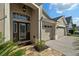 Inviting front entrance featuring a decorative glass door and tiled walkway at 7634 Nottinghill Sky Dr, Apollo Beach, FL 33572