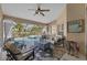 Relaxing lanai with comfortable seating overlooking the sparkling pool and lush landscaping at 7634 Nottinghill Sky Dr, Apollo Beach, FL 33572