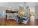Spacious living room featuring hardwood floors and an open layout at 7634 Nottinghill Sky Dr, Apollo Beach, FL 33572