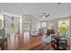 Inviting living room with hardwood floors and abundant natural light at 7634 Nottinghill Sky Dr, Apollo Beach, FL 33572