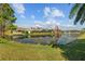 Scenic view of the pond with houses in the background at 7634 Nottinghill Sky Dr, Apollo Beach, FL 33572