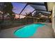 Screened-in pool area with a hot tub and string lights at 7634 Nottinghill Sky Dr, Apollo Beach, FL 33572
