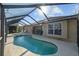 Beautiful pool with a hot tub, and screen enclosure, providing privacy and relaxation at 7634 Nottinghill Sky Dr, Apollo Beach, FL 33572