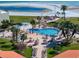 Aerial view showing the pool and grilling area near the beach at 825 S Gulfview Blvd # 208, Clearwater Beach, FL 33767