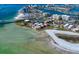 Extensive aerial view featuring residential buildings, a pool, a bridge and a tennis court at 825 S Gulfview Blvd # 208, Clearwater Beach, FL 33767