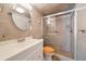 Bathroom with walk-in shower and vanity at 825 S Gulfview Blvd # 208, Clearwater Beach, FL 33767