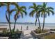 Beach access path leads to white sands and tranquil gulf waters at 825 S Gulfview Blvd # 208, Clearwater Beach, FL 33767