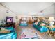 Bright living room with couches, rug, television and mirrored wall at 825 S Gulfview Blvd # 208, Clearwater Beach, FL 33767