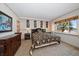 Comfortable main bedroom with patterned bedspread and view of the ocean at 825 S Gulfview Blvd # 208, Clearwater Beach, FL 33767
