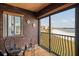 A cozy sun room with beach and water views at 825 S Gulfview Blvd # 208, Clearwater Beach, FL 33767