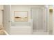 Bright bathroom with a separate shower, a soaking tub, and modern fixtures at 9304 Bonita Mar Dr, Parrish, FL 34219