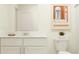 Bright bathroom featuring white vanity, mirror, and simple accents for a modern feel at 9304 Bonita Mar Dr, Parrish, FL 34219
