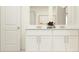 Stylish bathroom featuring double sinks, modern vanity, and ample storage space at 9304 Bonita Mar Dr, Parrish, FL 34219
