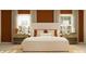 Cozy bedroom featuring a well-made bed, bedside tables, decorative lighting, and plush pillows at 9304 Bonita Mar Dr, Parrish, FL 34219