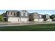 Stylish townhomes featuring attached garages and modern architectural details in a well-manicured community at 9304 Bonita Mar Dr, Parrish, FL 34219