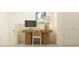 Cozy home office area with wooden desk, natural light, and closet for storage at 9304 Bonita Mar Dr, Parrish, FL 34219