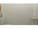 Simple powder room design with floating sink, wall art and clean design at 9304 Bonita Mar Dr, Parrish, FL 34219