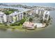 An aerial view highlighting the location of a condo, showcasing its waterfront position, pool, and clubhouse at 9425 Blind Pass Rd # 507, St Pete Beach, FL 33706