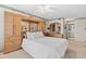 Bright bedroom featuring a queen bed, built-in wardrobe, and ensuite bathroom at 9425 Blind Pass Rd # 507, St Pete Beach, FL 33706