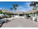 Exterior of clubhouse with palm trees and well-maintained landscaping at 9425 Blind Pass Rd # 507, St Pete Beach, FL 33706