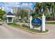 Elegant entrance to Yacht & Tennis Club of St. Pete Beach with lush landscaping and clear signage at 9425 Blind Pass Rd # 507, St Pete Beach, FL 33706