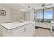 Bright, functional kitchen with a large island, ample cabinet space, and a window with a view at 9425 Blind Pass Rd # 507, St Pete Beach, FL 33706