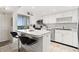 Bright kitchen with a breakfast bar and stainless steel appliances provides style and functionality at 9425 Blind Pass Rd # 507, St Pete Beach, FL 33706
