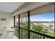 Relax on this private lanai with views of lush greenery and a beautiful waterway at 9425 Blind Pass Rd # 507, St Pete Beach, FL 33706